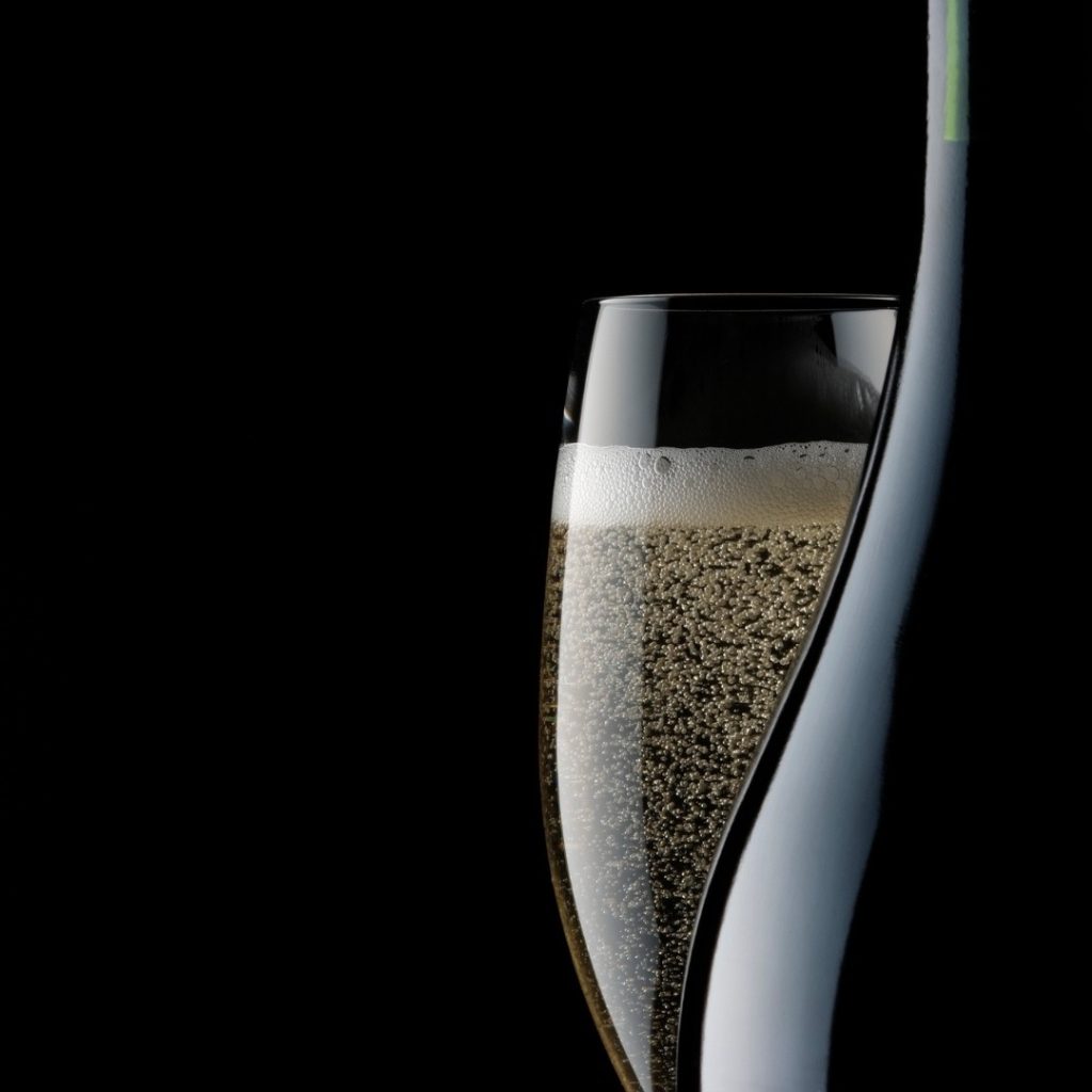 Prosecco and glass in front of a black background for the summer offer at hatton court hotel