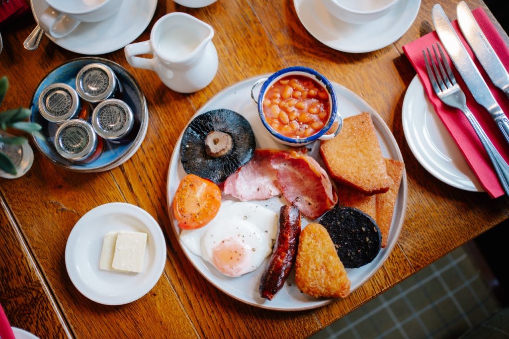 Full English Breakfast on a table in a hotel.